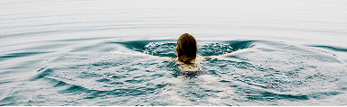 Person practicing Radical Forgiveness in water for emotional healing.