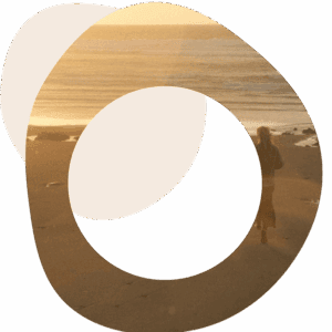 Abstract image of someone standing on a beach looking out to sea
