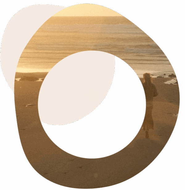 Abstract image of someone standing on a beach looking out to sea