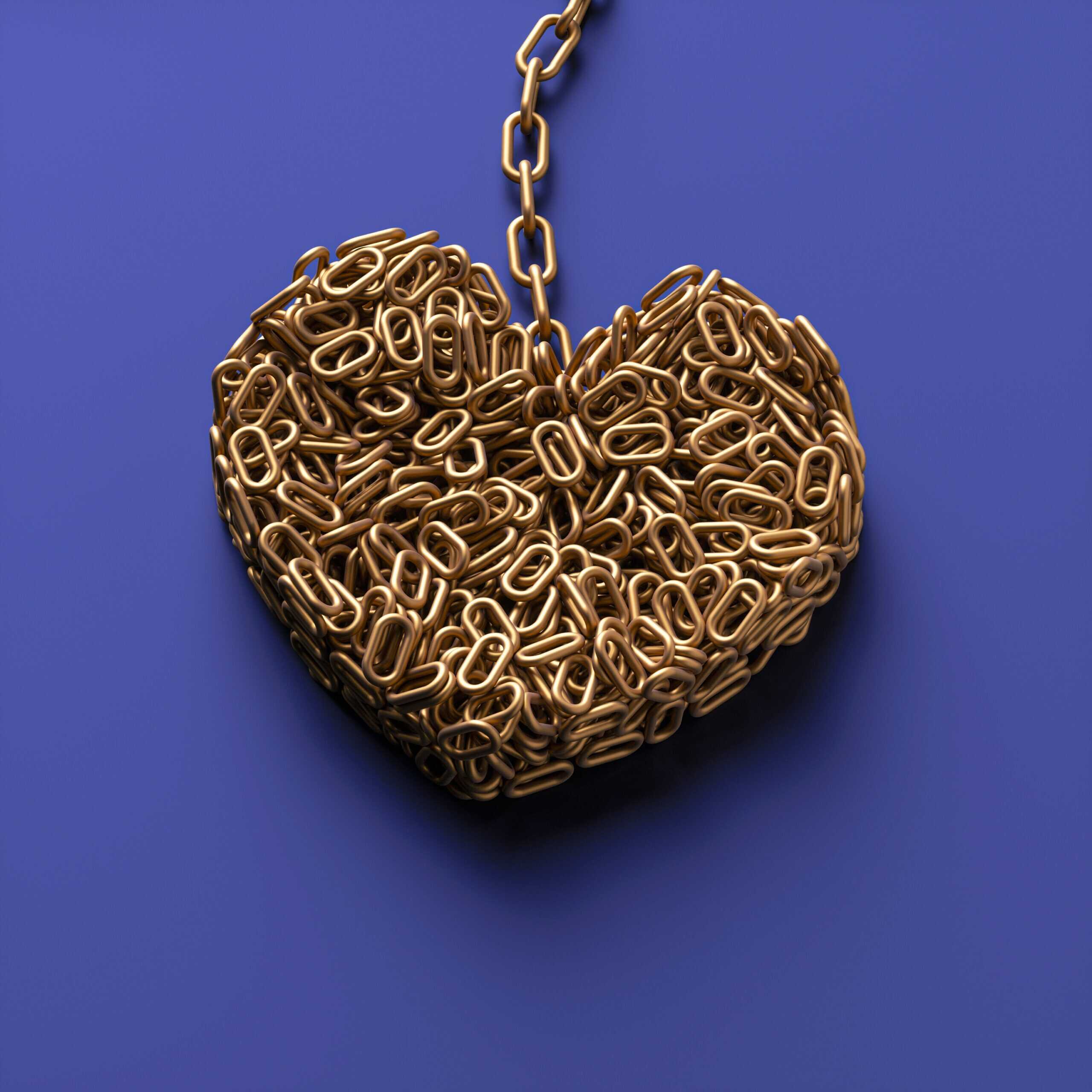 A heart shaped object made of metal chains to form the shape